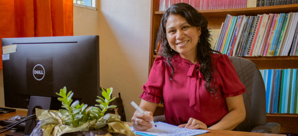 Principal Yesmi at her desk