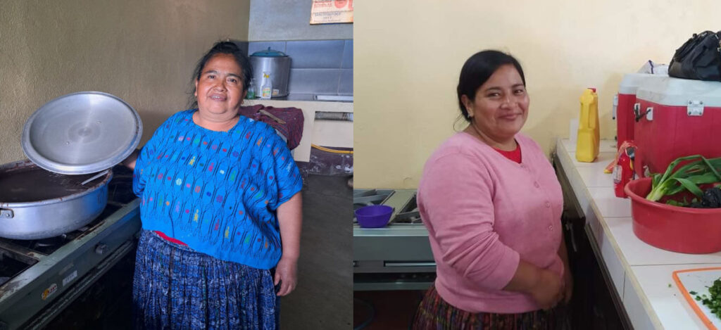 Two Guatemalan Women in traditional dress standing in a school kitchen