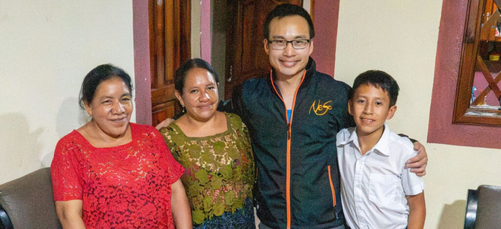 inguatemala-WEB Alvin standing with a Guatemalan family